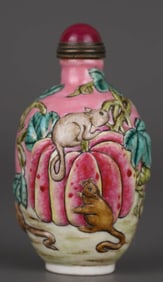A IRON-RED GLAZED CARVED AND ENAMELED 'SQUIRREL' SNUFF BOTTLE