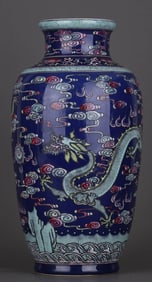 A BLUE GLAZED FAMILLE ROSE 'DRAGON AND CLOUD' LANTERN SHAPED VASE