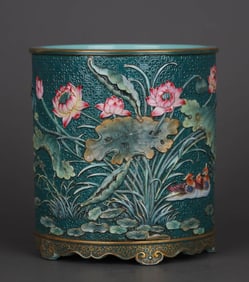 A GREEN-GLAZED CARVED AND ENAMELED 'LOTUS AND MANDARIN DUCK' BRUSH POT