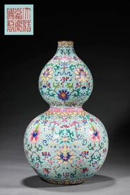 A TURQUOISE-GREEN GLAZED FAMILLE ROSE 'FLORAL' GOURD SHAPED VASE