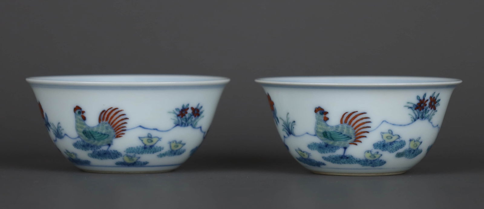 A DOUCAI 'CHICKEN' CUP: A DOUCAI 'CHICKEN' CUP Dimensions: Height: 3.1 cm (1.22 in.), Mouth Diameter: 6.8 cm (2.68 in.). All measurements are approximate. Any condition statement is given as a courtesy to a client, is only a