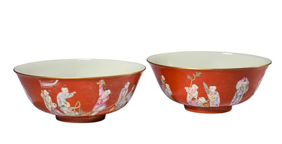 A PAIR OF CORAL-GROUND FAMILLE ROSE 'CHILDREN AT PLAY' BOWLS