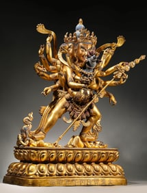 A COPPER-GILT VAJRA WITH VICTORY AND MUSIC