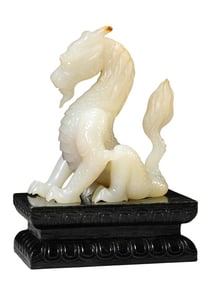 A JADE DRAGON WITH JADEITE STAND