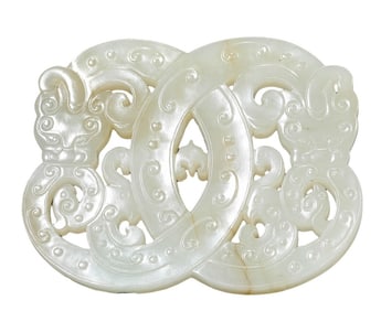 A JADE CARVED INTERTWINED DRAGON PENDANT
