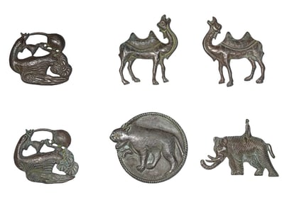 A SET OF SILVER ANIMAL PLAQUES