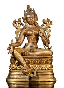 A COPPER-GILT LOTUS HAND AVALOKITESHVARA