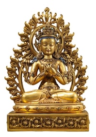 A COPPER-GILT LOTUS HAND AVALOKITESHVARA