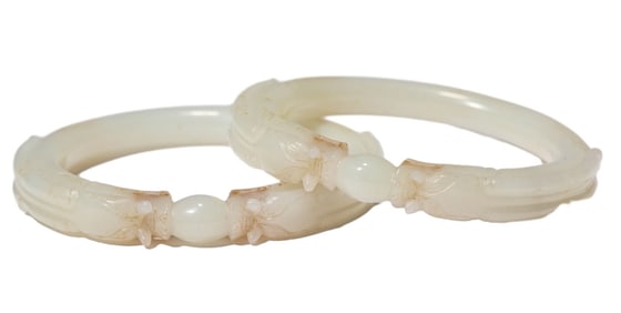 A JADE CARVED CHI DRAGON BRACELET SET
