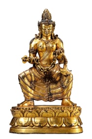 A COPPER-GILT BUDDHA STATUE