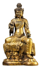 A COPPER-GILT AVALOKITESHVARA SITTING STATUE