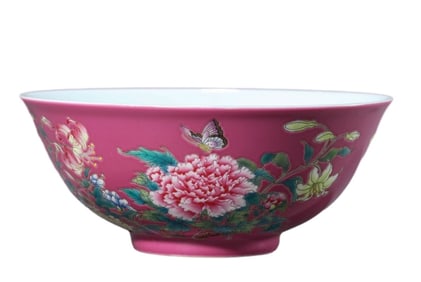 A RUBY-RED GROUND FAMILLE ROSE 'BUTTERFLIES, FLOWERS, AND POETIC' BOWL