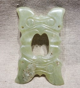A JADE 'SUN DEITY' BI