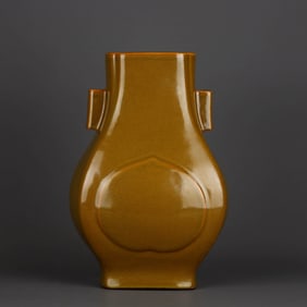 A YELLOW-GLAZED VASE