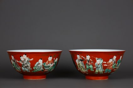 A PAIR OF CORAL-RED GROUND GILT DECORATED WUCAI 'SIXTEEN BOYS' BOWLS