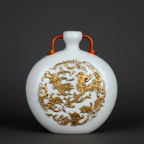 A SWEET WHITE-GLAZED CARVED WITH GILT DECORATED 'PHOENIX' MOONFLASK