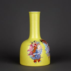 A YELLOW-GROUND FAMILLE ROSE 'BAT AND EIGHT IMMORTALS' BELL-SHAPED VASE