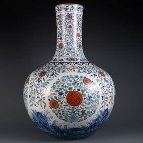 A DOUCAI 'WAVE, ROCK AND FLORAL MEDALLIONS' GLOBULAR VASE