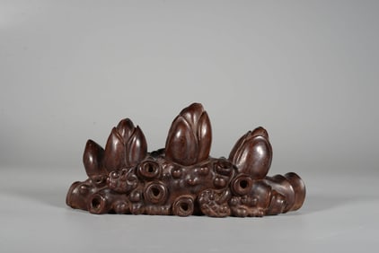 A ROSEWOOD 'MAGNOLIA' BRUSH REST