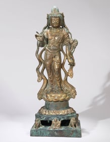 A GILT-BRONZE GUANYIN FIGURE