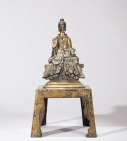 A GILT-BRONZE SHAKYAMUNI FIGURE