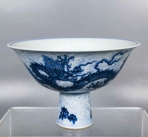 A BLUE AND WHITE 'DRAGON IN WAVES' STEM BOWL