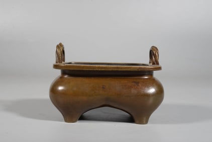 A BRONZE SQUARE BRIDGE-HANDLE CENSER