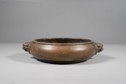A BRONZE BEAST-HANDLE CENSER