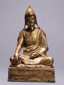 A GILT-COPPER AND REPOUSSé SEATED FIGURE OF TSONGKHAPA