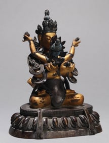 A GILT-BRONZE FIGURE OF MANJUSHRI