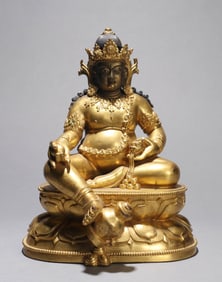 A GILT-COPPER ALLOY FIGURE OF JAMBHALA