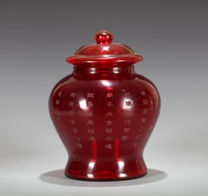 A RED GLASS JAR