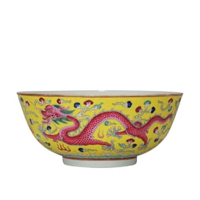 A LARGE YELLOW-GROUND FAMILLE-ROSE 'DRAGON AND PHOENIX' BOWL
