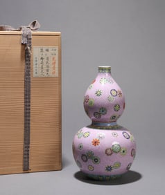 A FAMILLE-ROSE GROUND 'FLORAL' GOURD SHAPED VASE