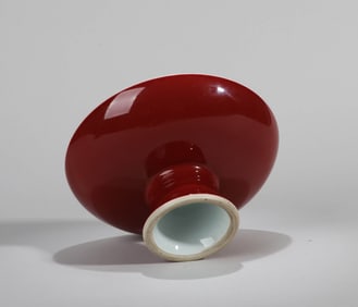 A RED-GLAZED STEM DISH