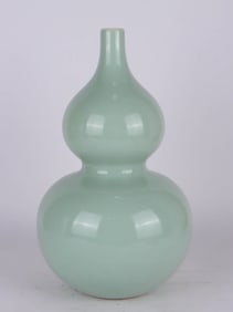 A CELADON-GLAZED GOURD SHAPED VASE