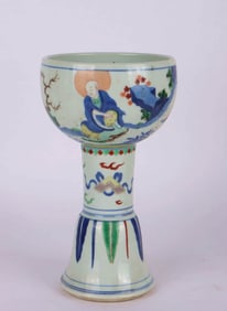 A BLUE AND WHITE WUCAI 'FIGURE' STEM WASHER