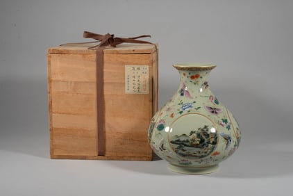 A CELADON-GROUND FAMILLE ROSE WITH FOUR MEDALLIONS 'MELON, BUTTERFLY, LANDSCAPE AND FIGURES' VASE