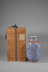 A BLUE-GROUND FAMILLE ROSE 'FLORAL' LANTERN-SHAPED VASE