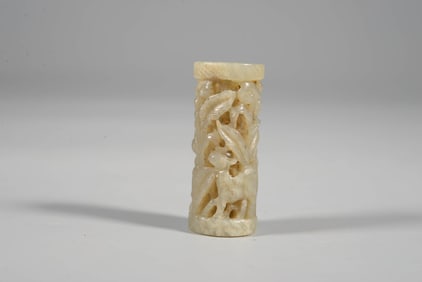 A JADE 'FIGURES' BEAD