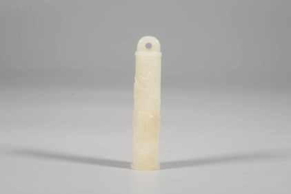 A WHITE JADE 'FLOWERS AND BIRDS' BELL-PIPE