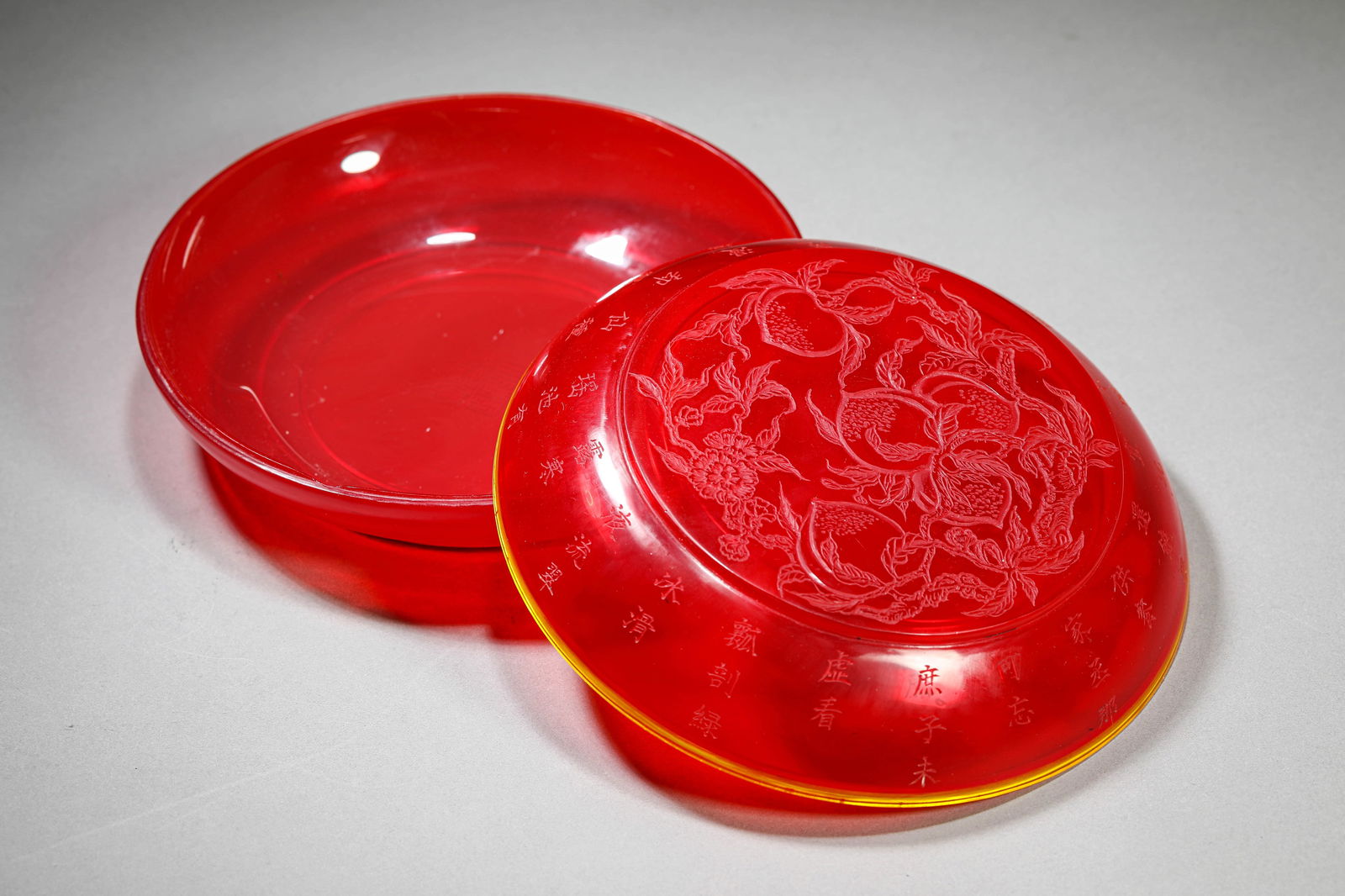 A RED GLASS 'BAT AND POEM' COVERED BOX