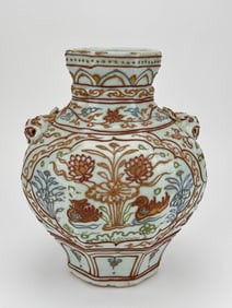 A GILT 'RIVER SCENE' BEAST-HANDLED JAR