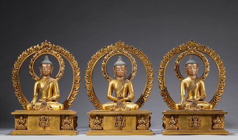 A GROUP OF GILT-BRONZE BUDDHIST FIGURES
