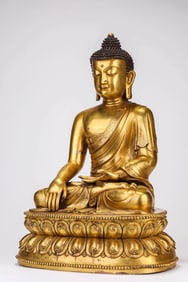 A GILT-BRONZE SHAKYAMUNI