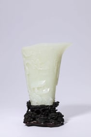 A JADE 'SCHOLAR UNDER PINE' RHINOCEROS HORN CUP