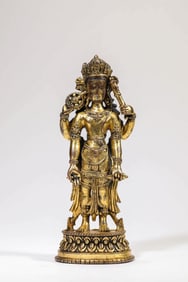 A GILT-BRONZE FOUR-ARMED AVALOKITESHVARA