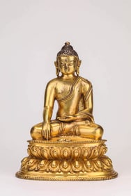 A GILT-BRONZE SHAKYAMUNI