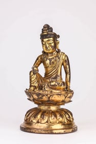 A GILT-BRONZE SEATED AVALOKITESHVARA