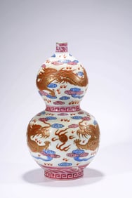 AN IRON-RED 'DRAGON' GOURD SHAPED VASE